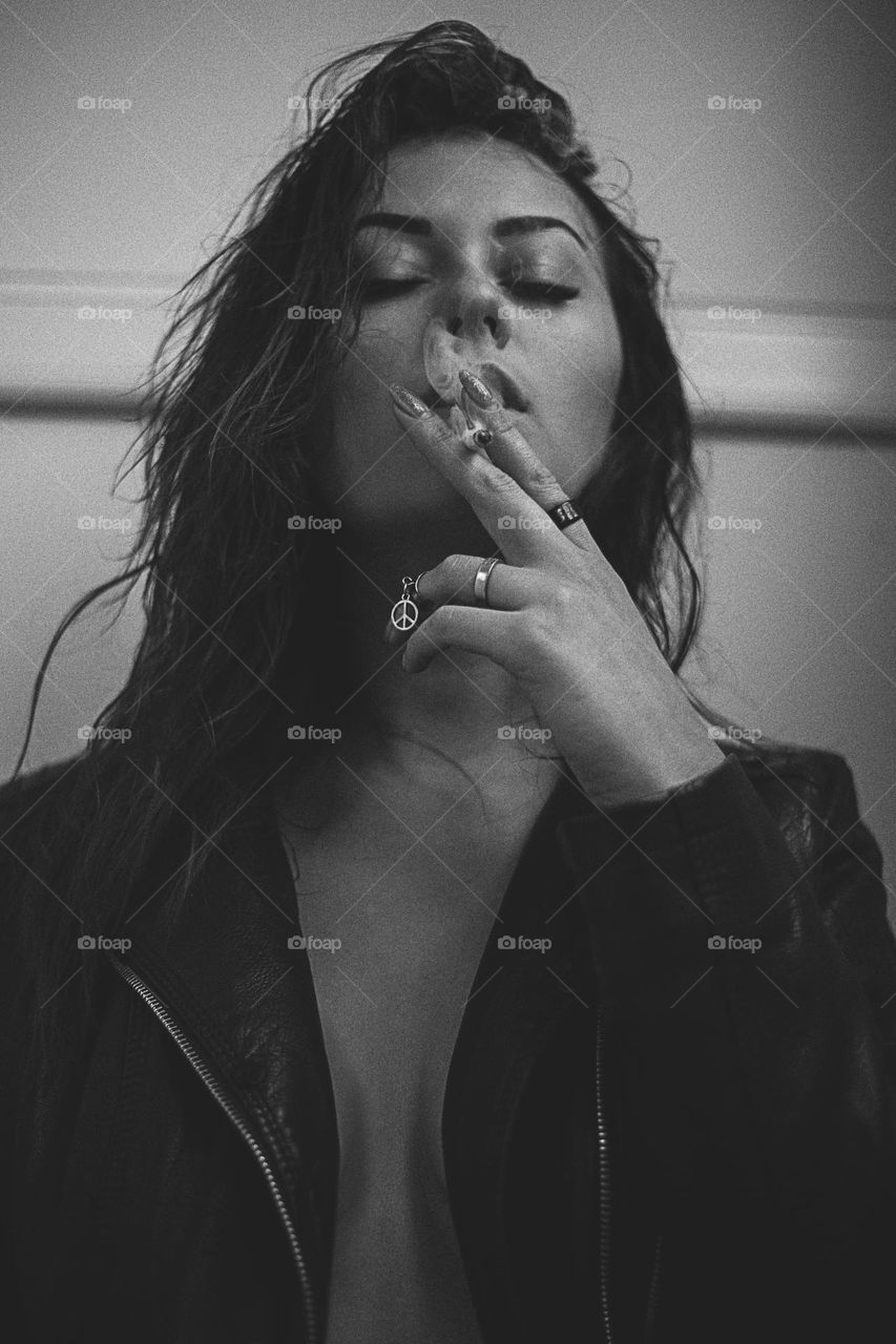 Black and white photo, girl smokes, beautiful woman 