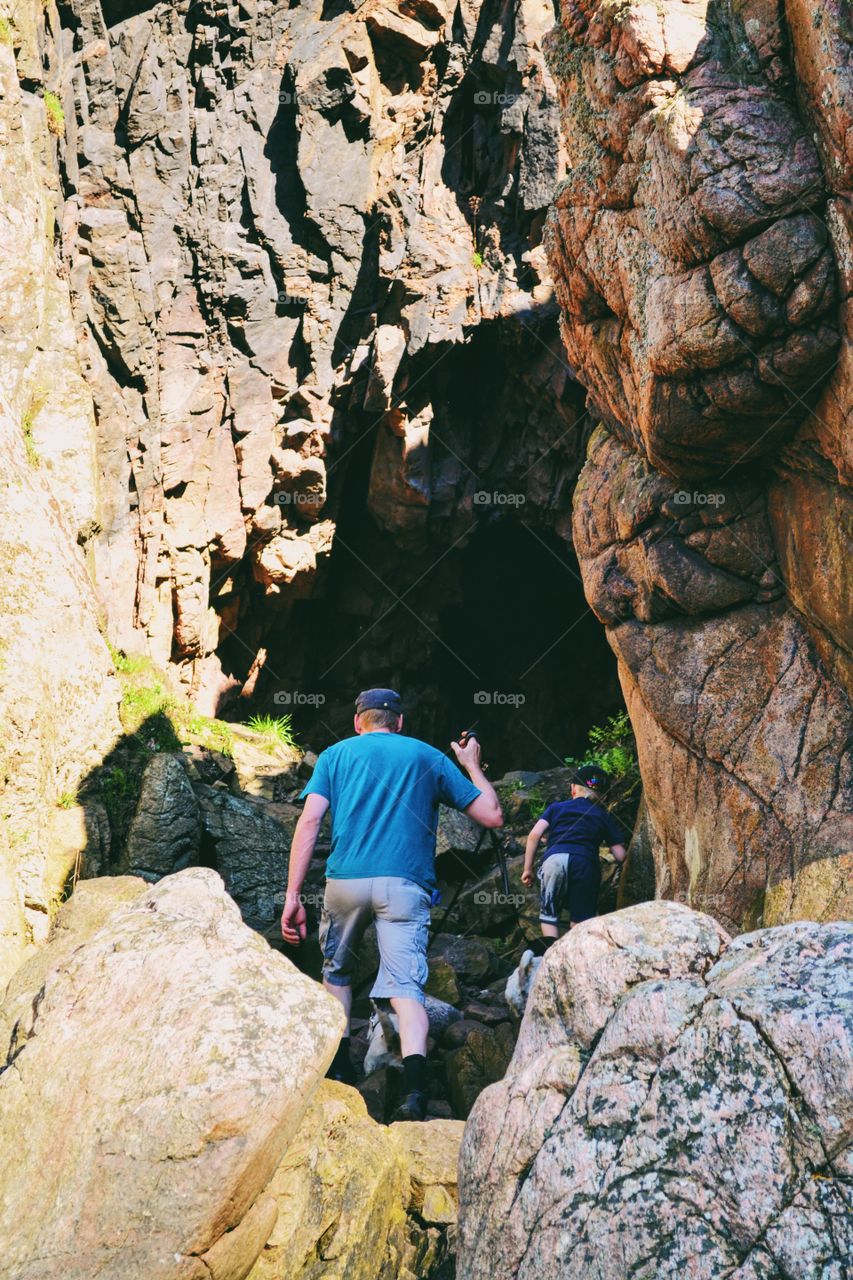 People exploring a cave