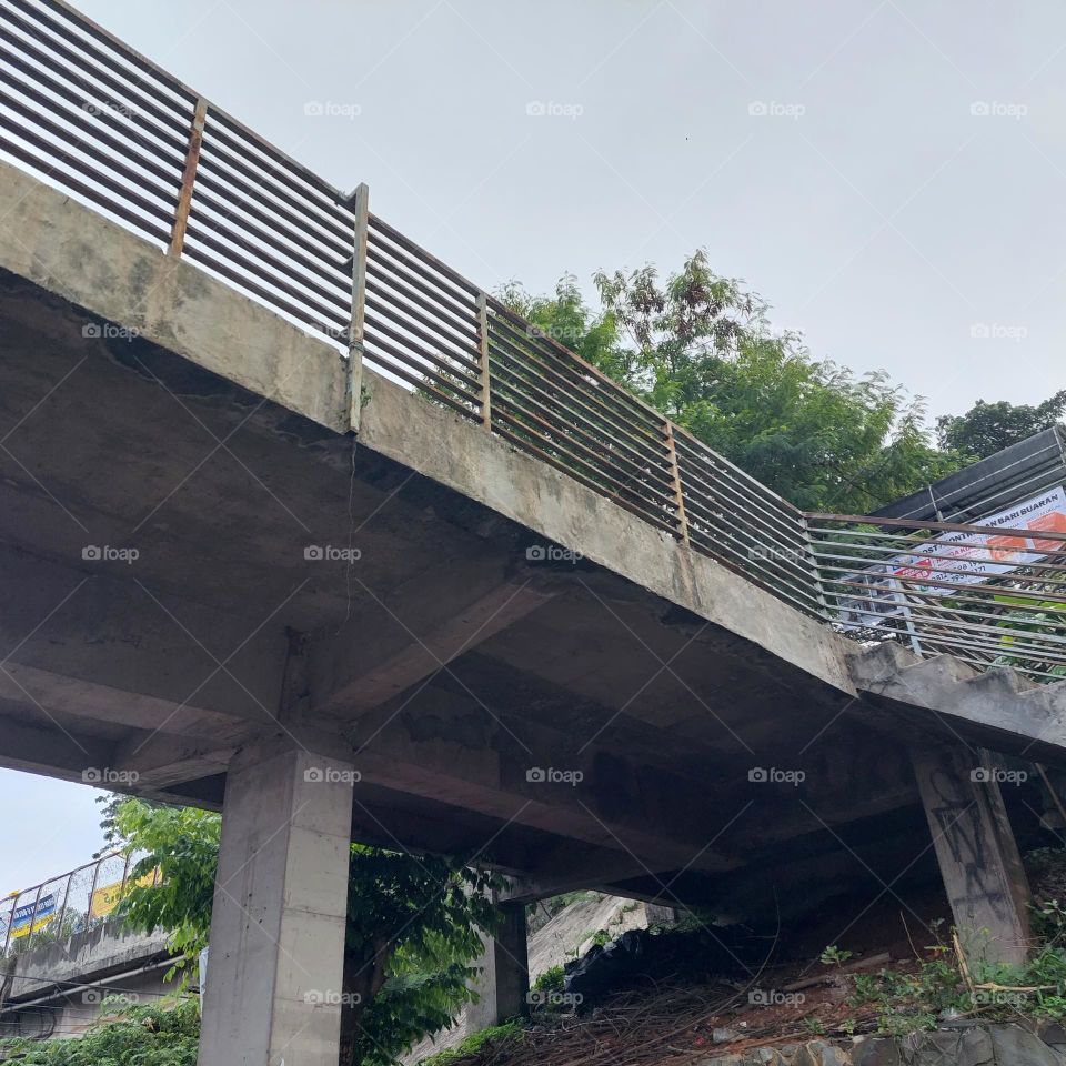 railway passenger crossing bridge from the road to the station
