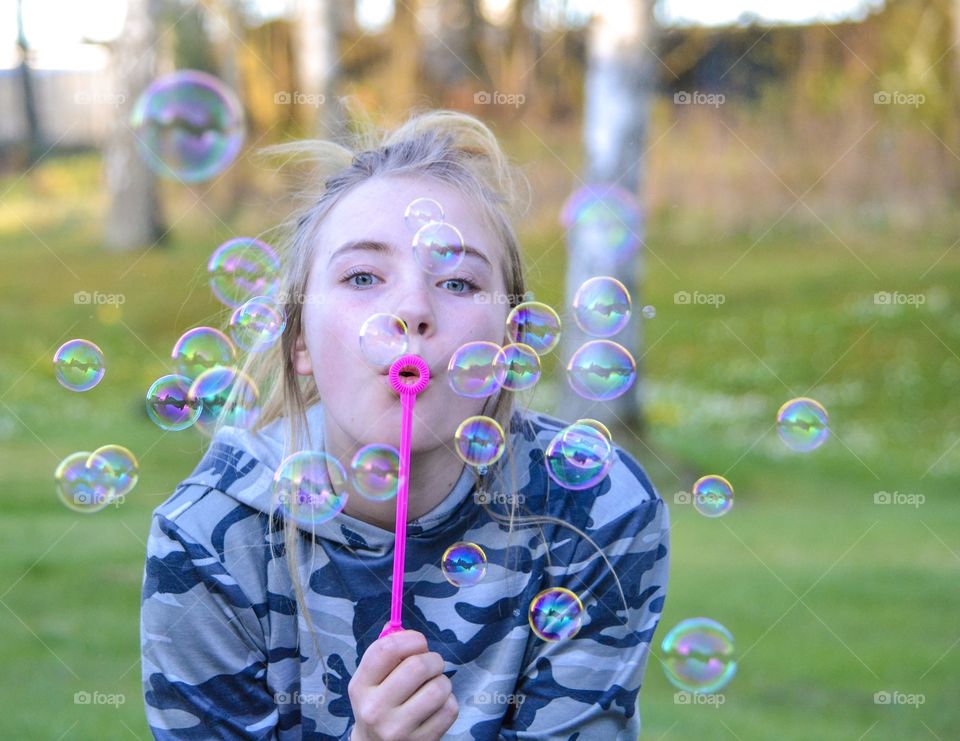 Girl blowing bubbles