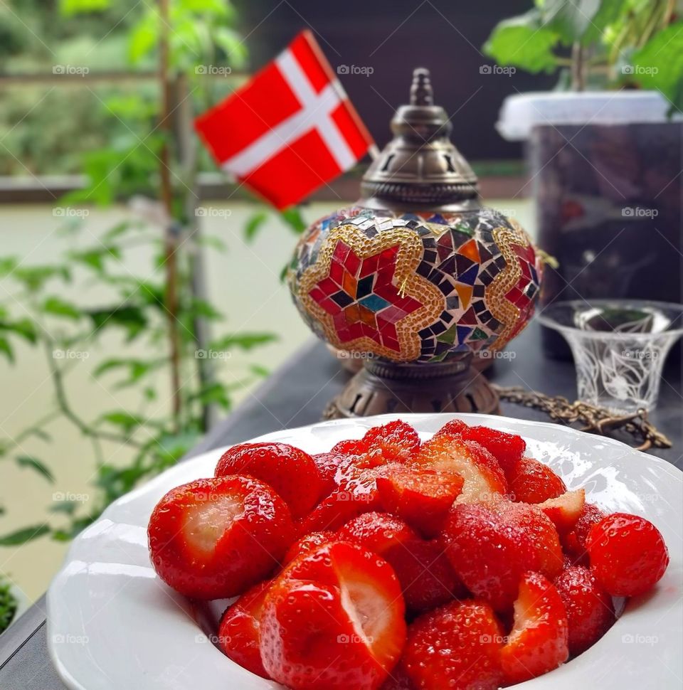 enjoying balcony life with freshly picked strawberries