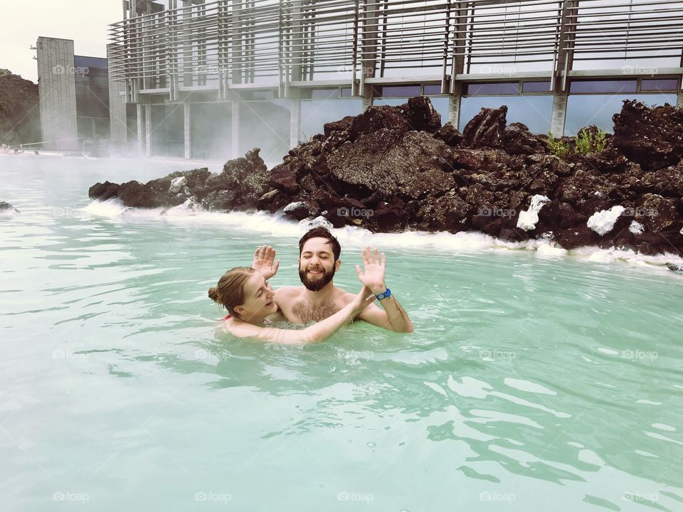 My sister and her boyfriend trying not to get their hands dirty at the Blue Lagoon in Iceland :)