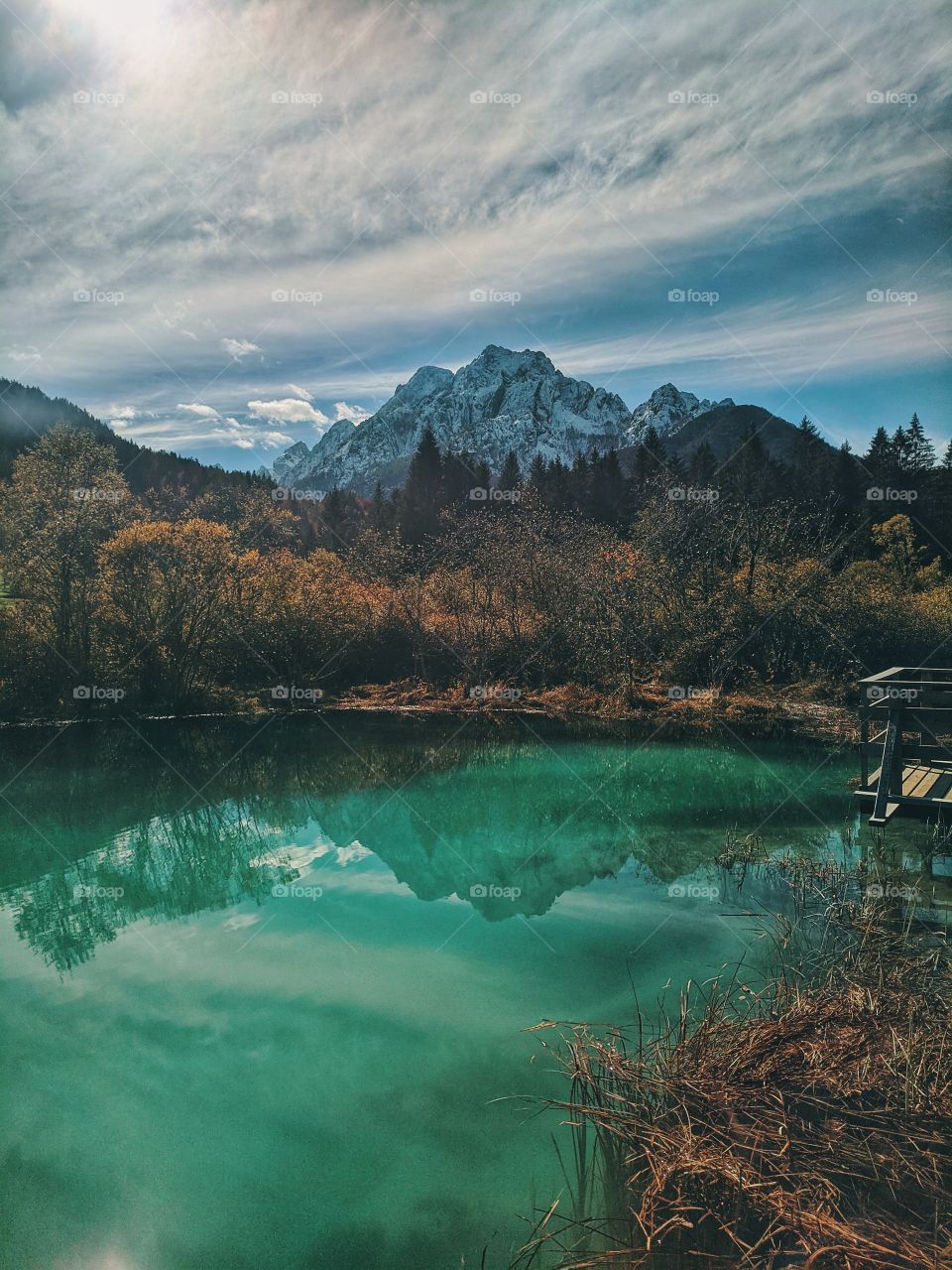 Scenic view on the mountains against the blue slovenian lake.