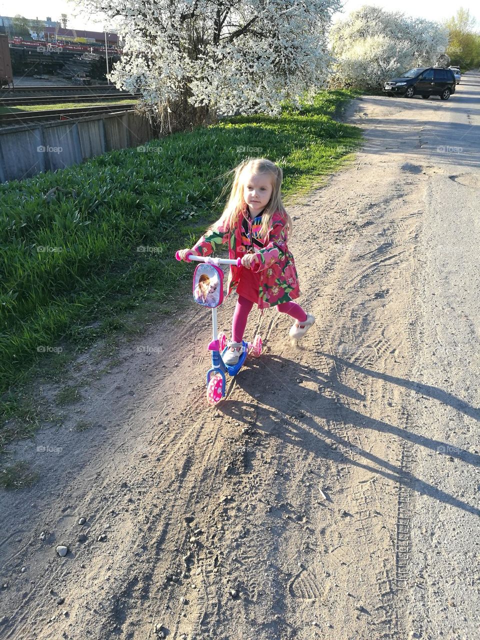 A girl with a scooter