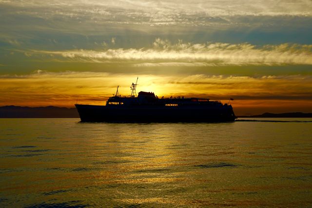 Silhouette of a boat at sunset