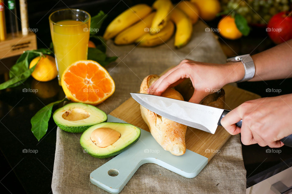 girl making breakfast with avocado and bread