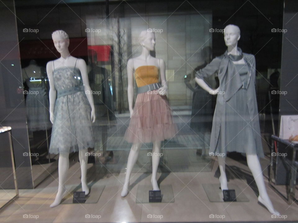 Ginza, Tokyo, Japan.  Shop Window with Three Mannequins Showing Women's Dresses. Designer Spring Fashion.