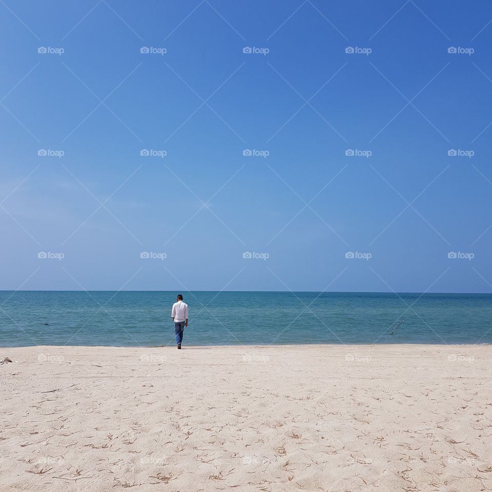 Man stands on the beach