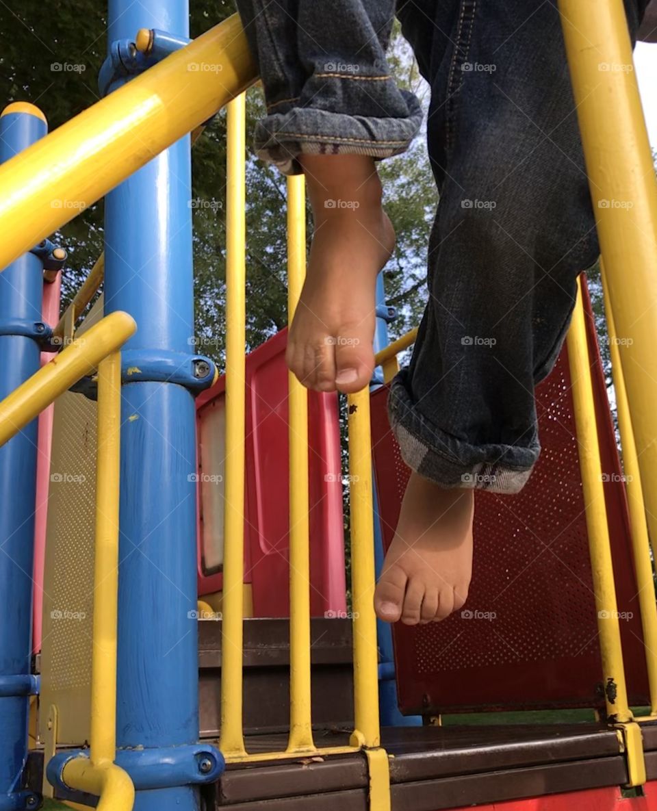Barefoot on the playground equipment