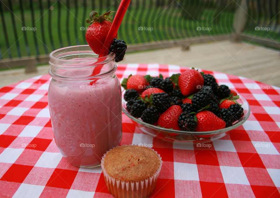 Berry Morning . Berry smoothie, strawberries, blackberries and muffin to start the day. 