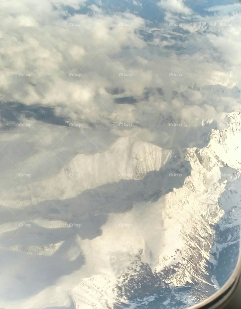 Colorado Rockies from a Plane Window. Flying over the Rockies heading to Vegas.