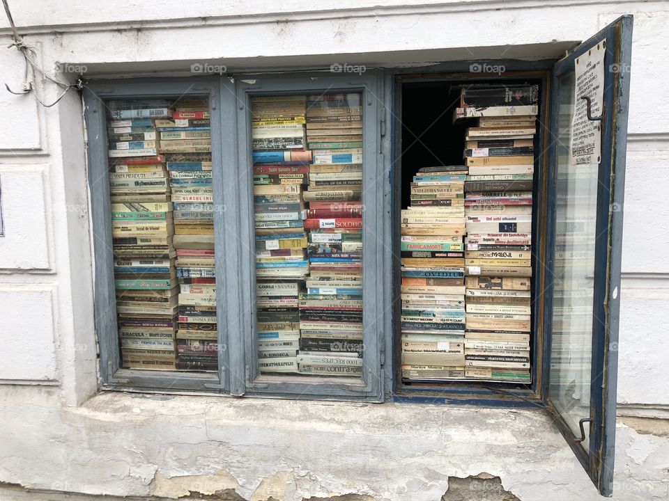 Old vintage bookshop behind a window, Bucharest, Romania