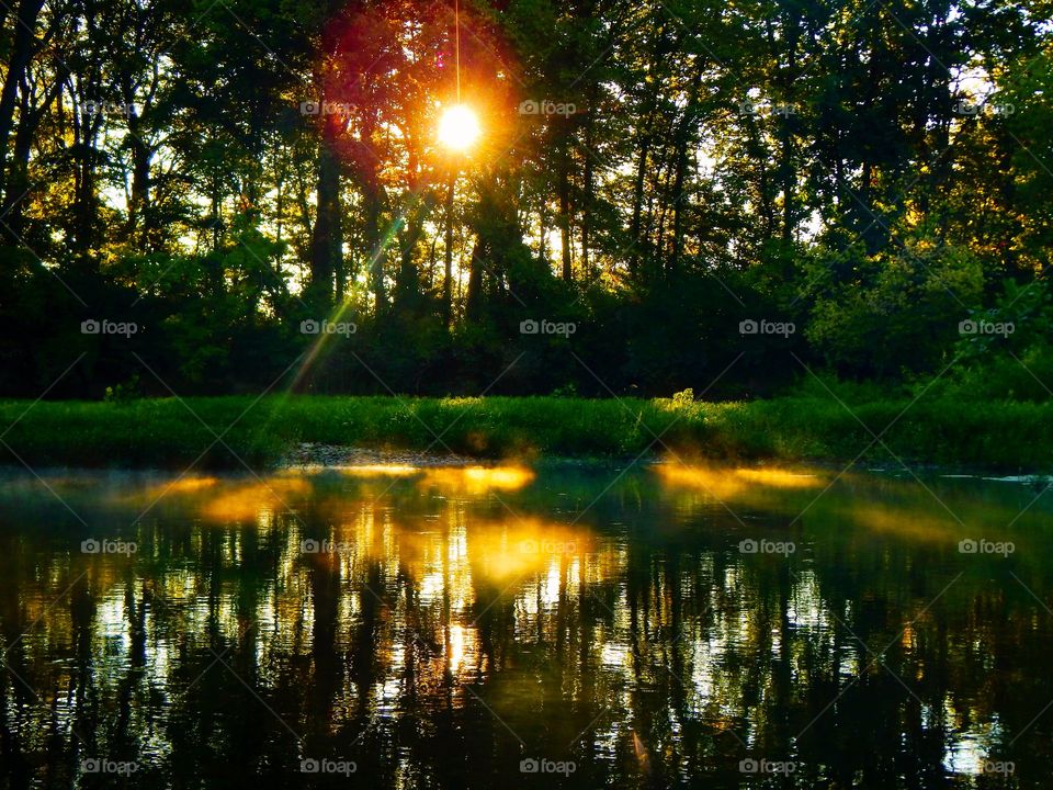 Sunrise over a foggy river in Indiana 