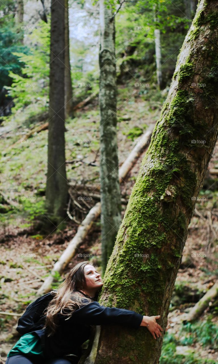 Woman admiring the woods in late summer