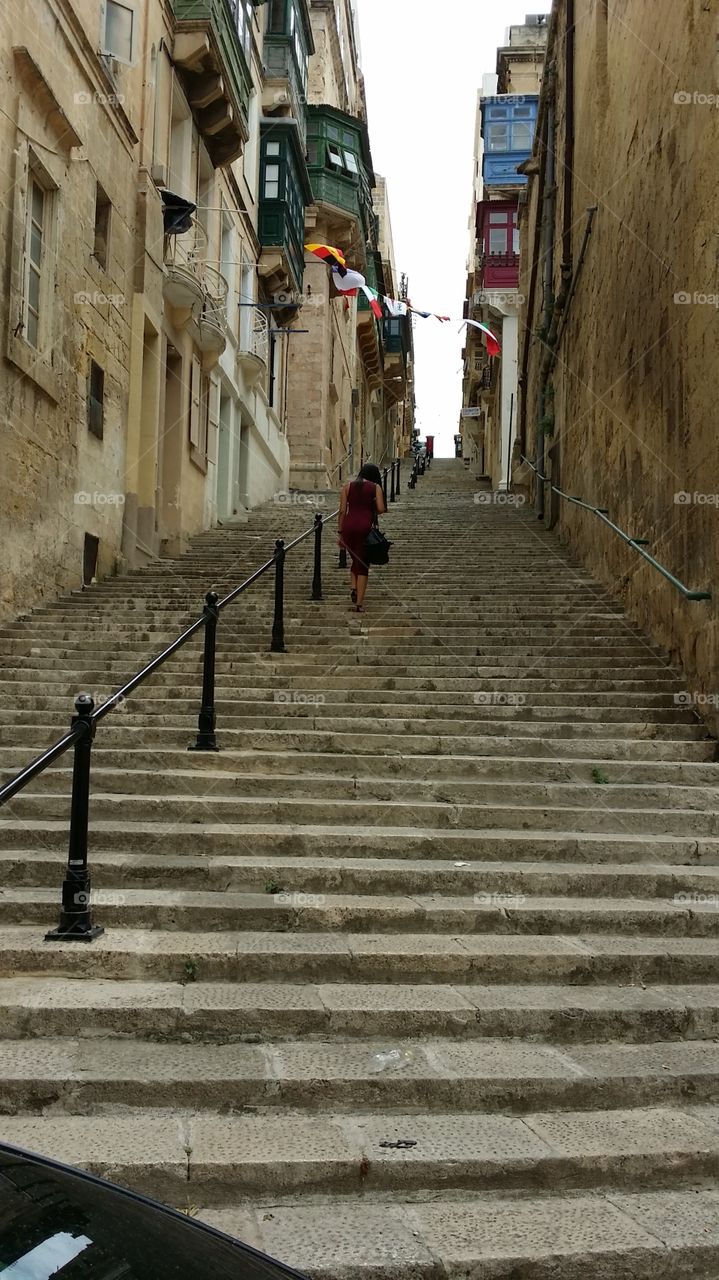 Climbing steep steps in Valletta