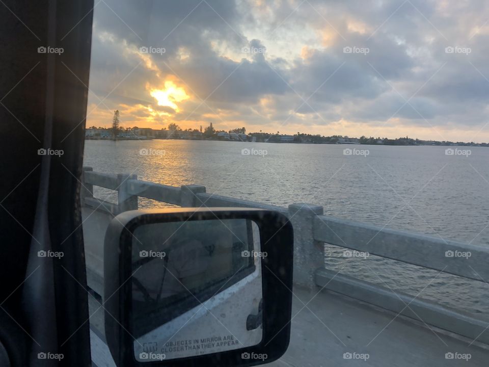 Bridge to Cortez Beach at sunset in a Jeep Wrangler