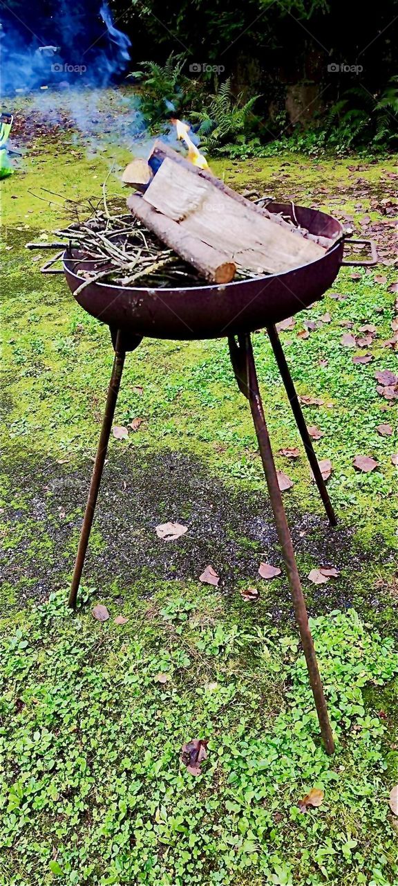 The bonfire at the “Market of Possibilities” in the garden and apple orchard of the old castle of “Steinach” in “Lower Bavaria”, Germany is just starting to glimmer and catch a flame for future joys to behold. 2024. Hypnotic Productions