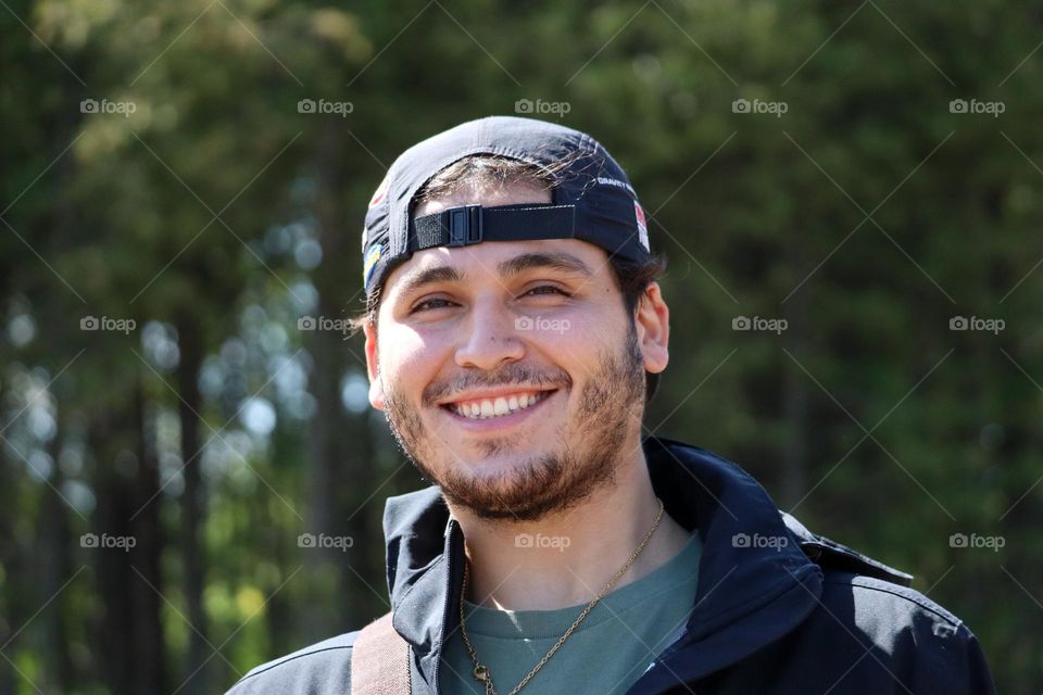 Happily smiling young man