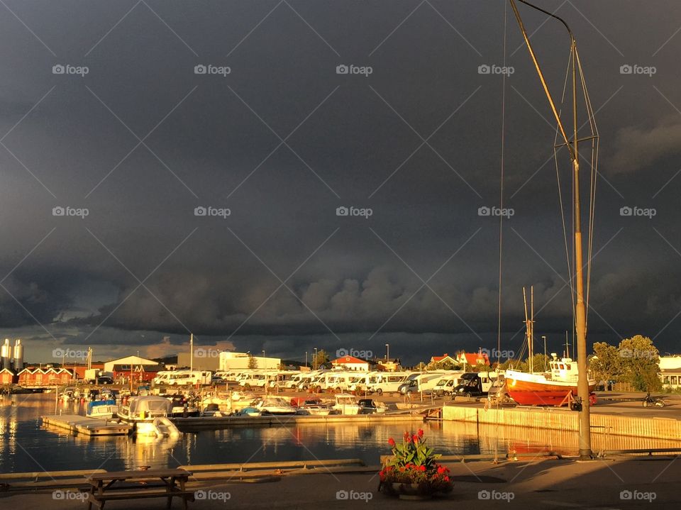 Black sky in the harbour before the storm