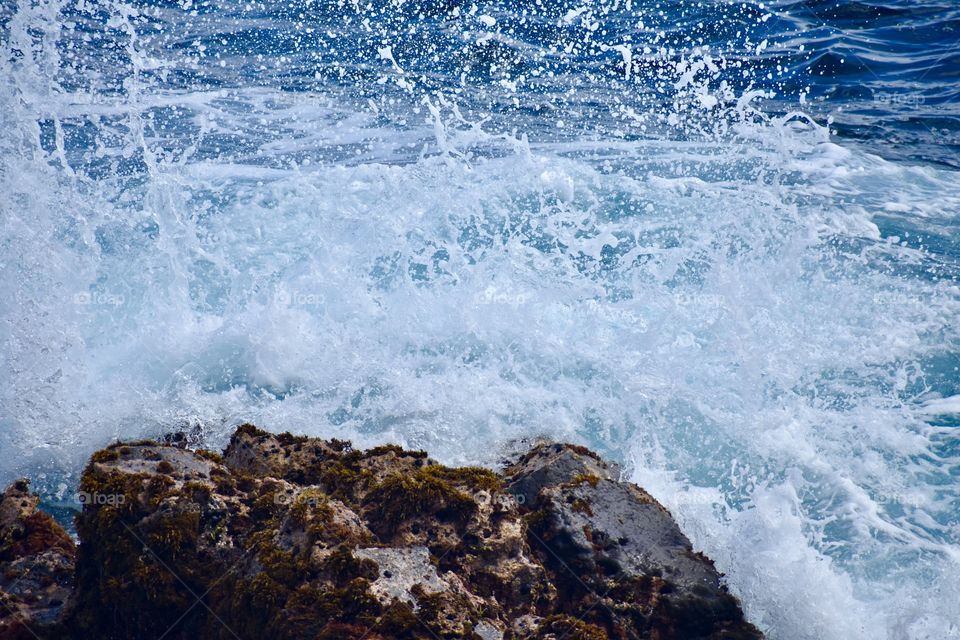 A splash on the rock of the sea cliffs