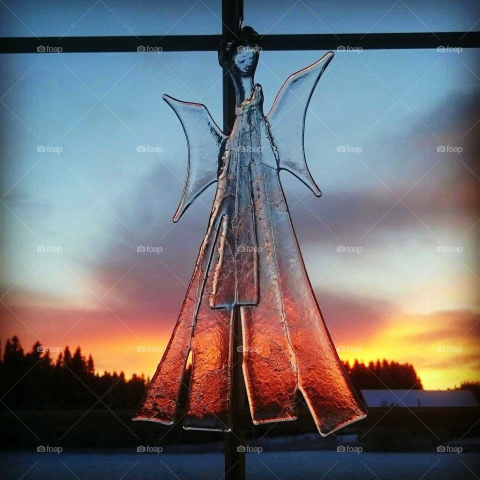 Ice angel hanging during dusk