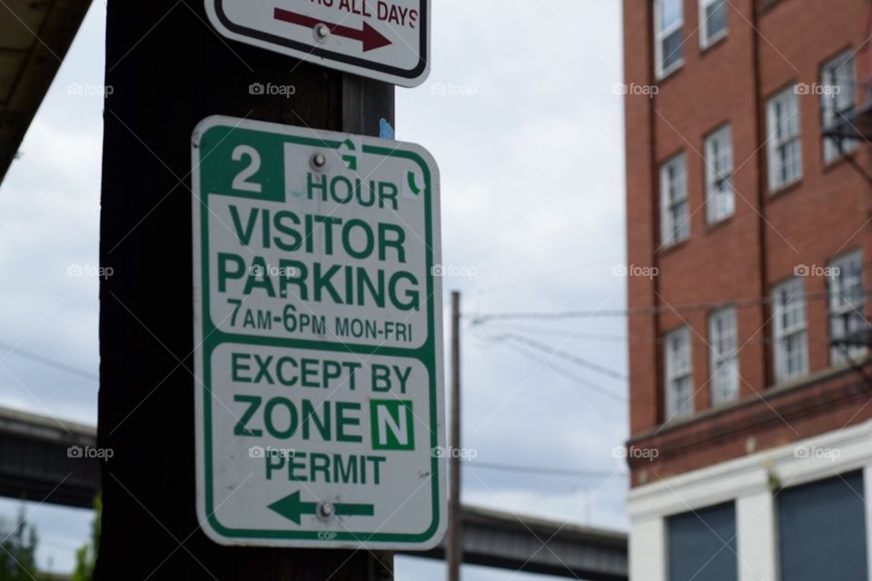 2hr Parking Sign. The Meter Maid is lurking. Portland, Oregon. 