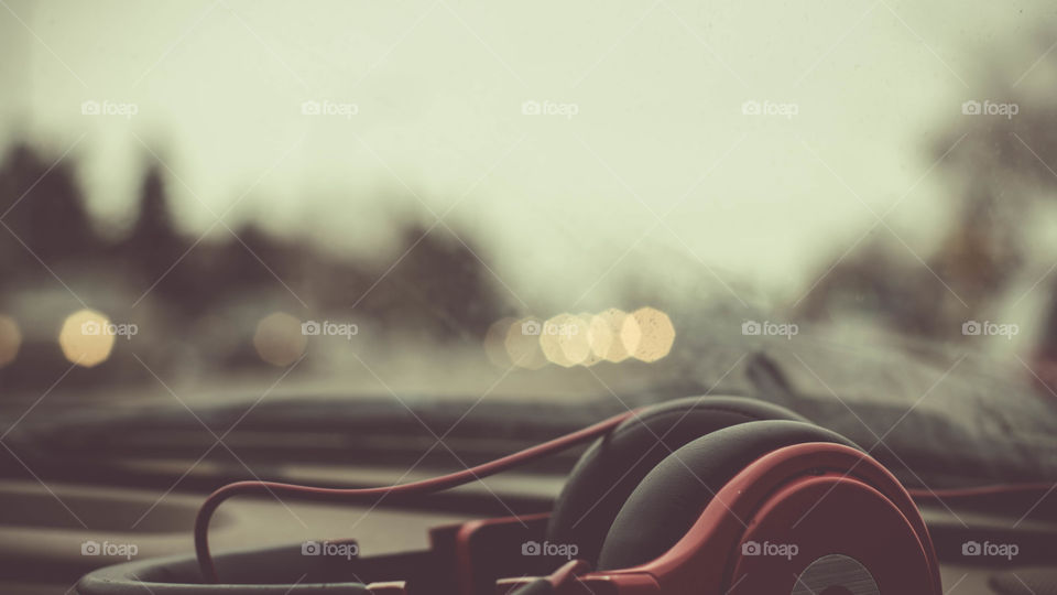 beautiful vintage bokeh lights, blurry background, street view, red beats by Dre headphones