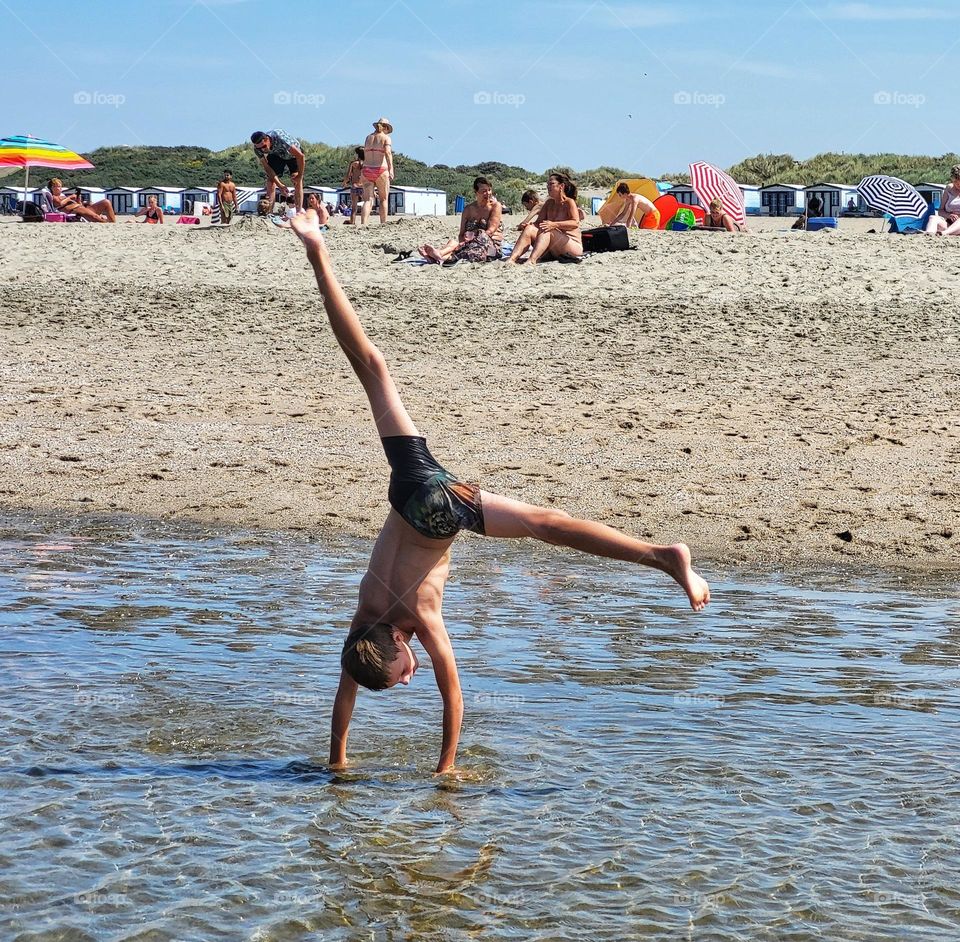 Acrobatic on the beach.