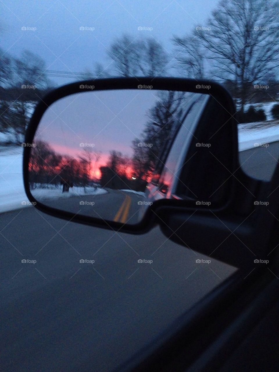 Sunset in the rearview mirror