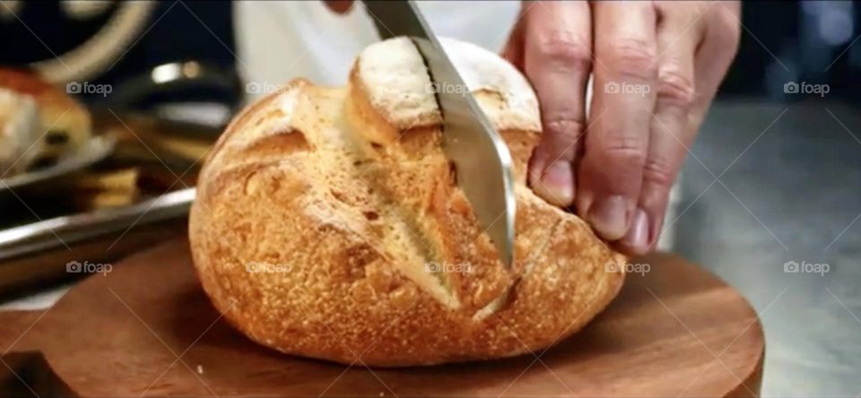 cutting homemade bread