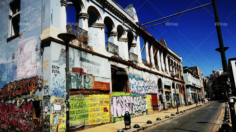 Street art in Valparaiso, Chile.  Building covered in Graffiti