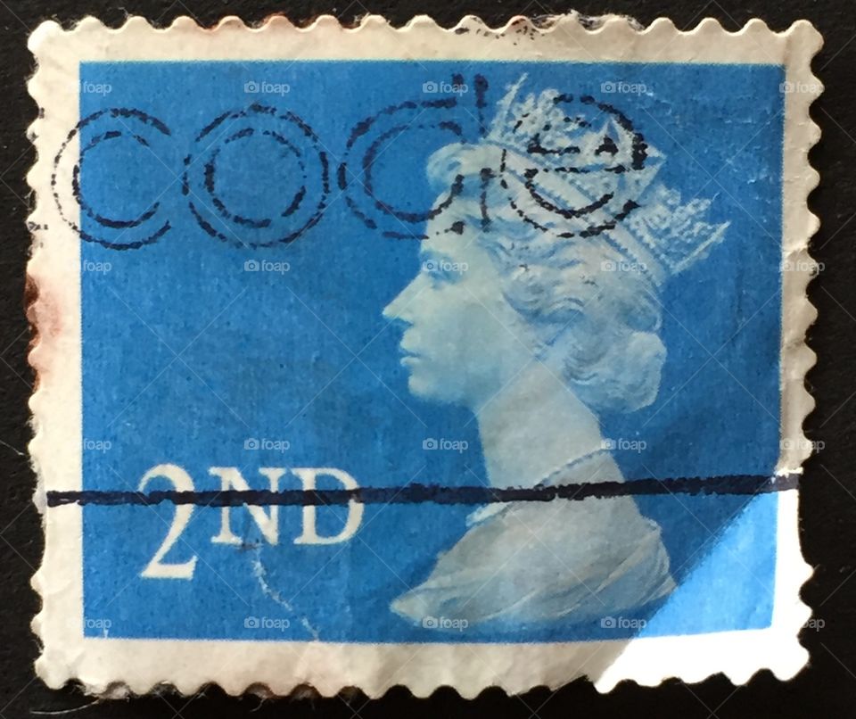 British stamp second class postage blue with rubber stamp code on the stamp