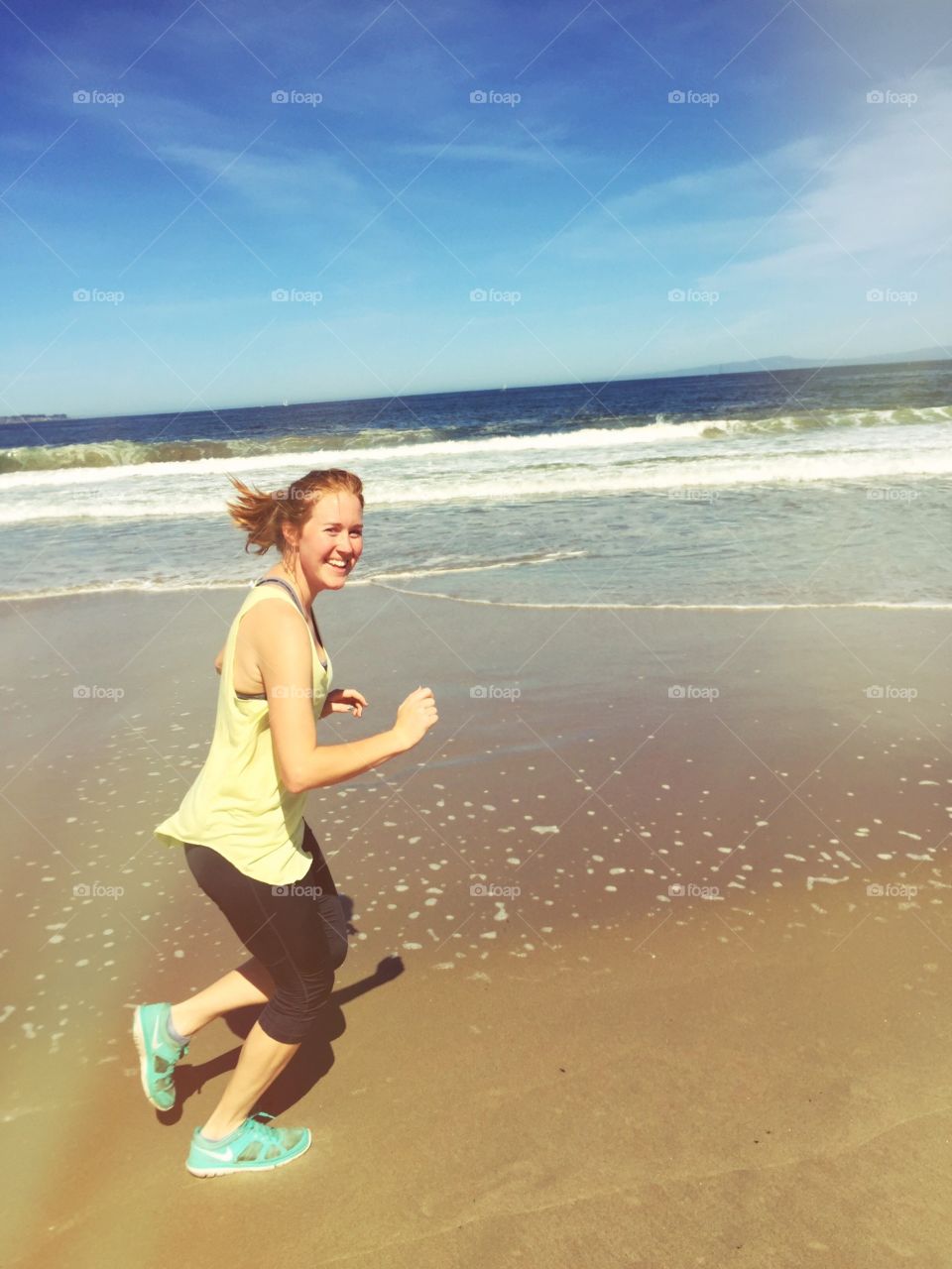 She's so happy running on the beach!