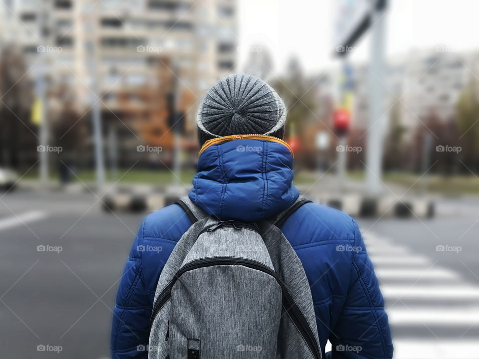 Hiking with a backpack through the city 