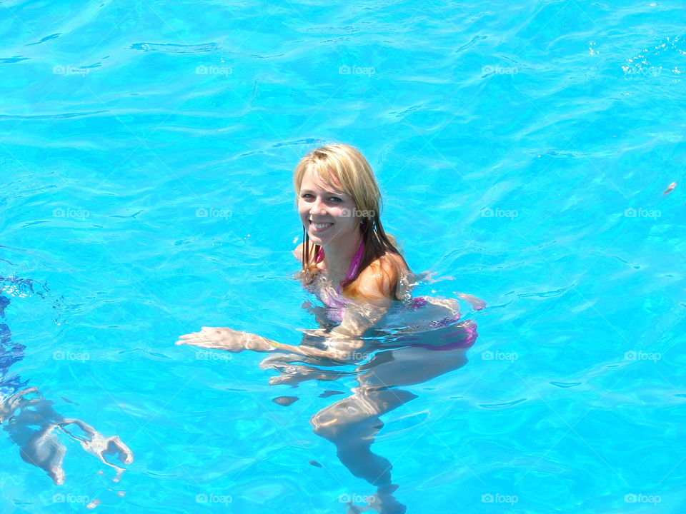 Happy woman in swimming pool
