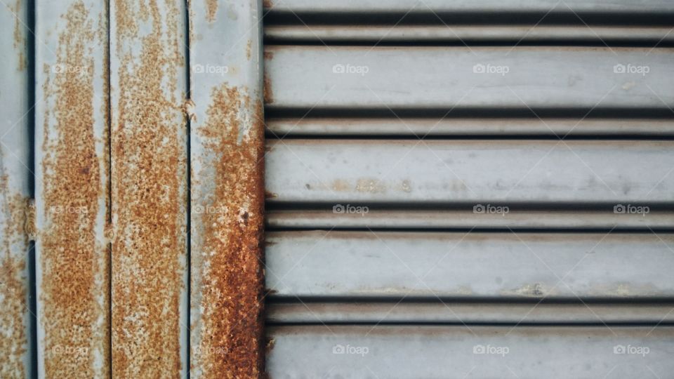 The pattern of rusted steel doors