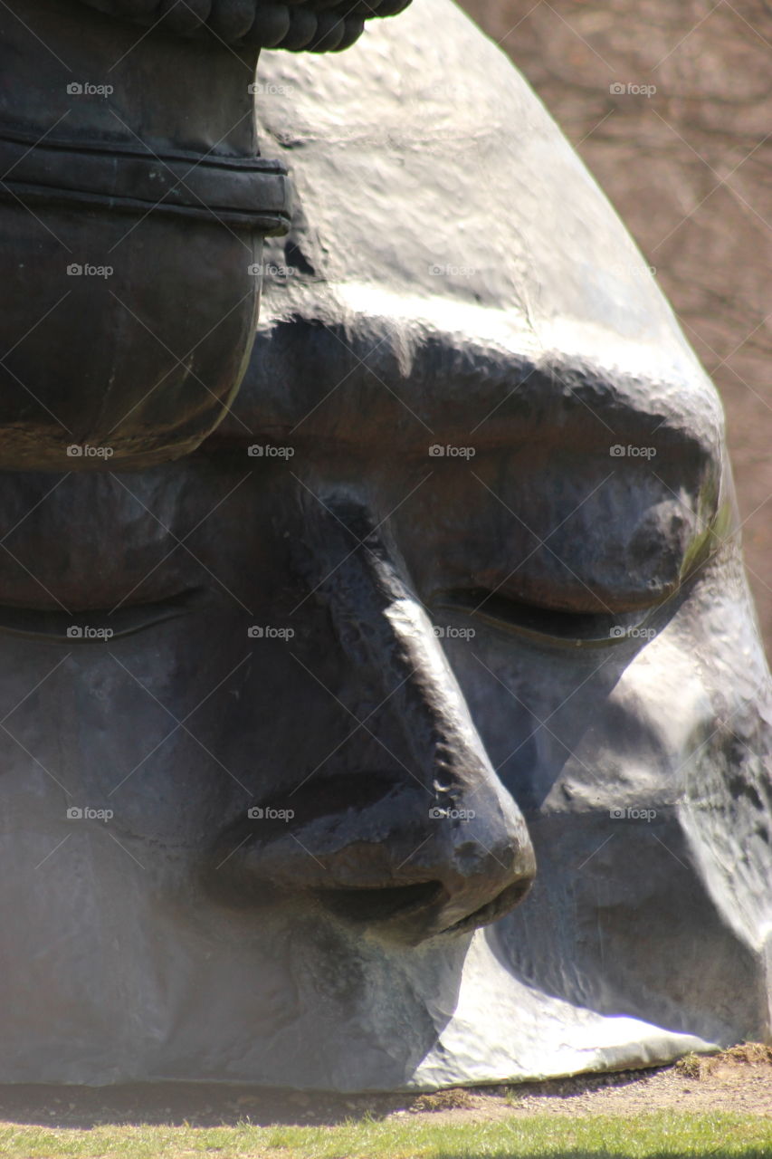 Part of a mans face as part of a unique sculpture found at Storm King