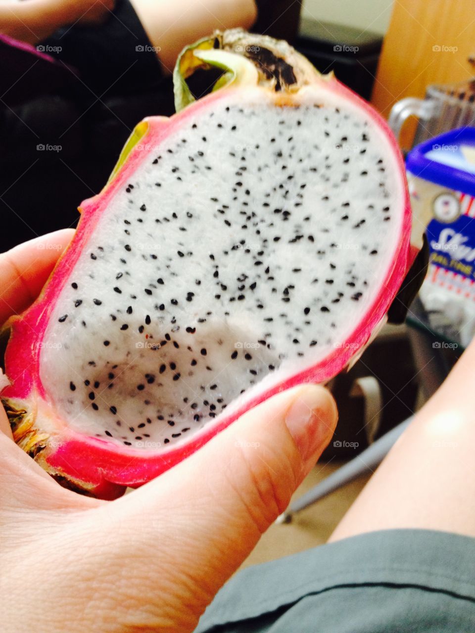 Holding dragon fruit meat