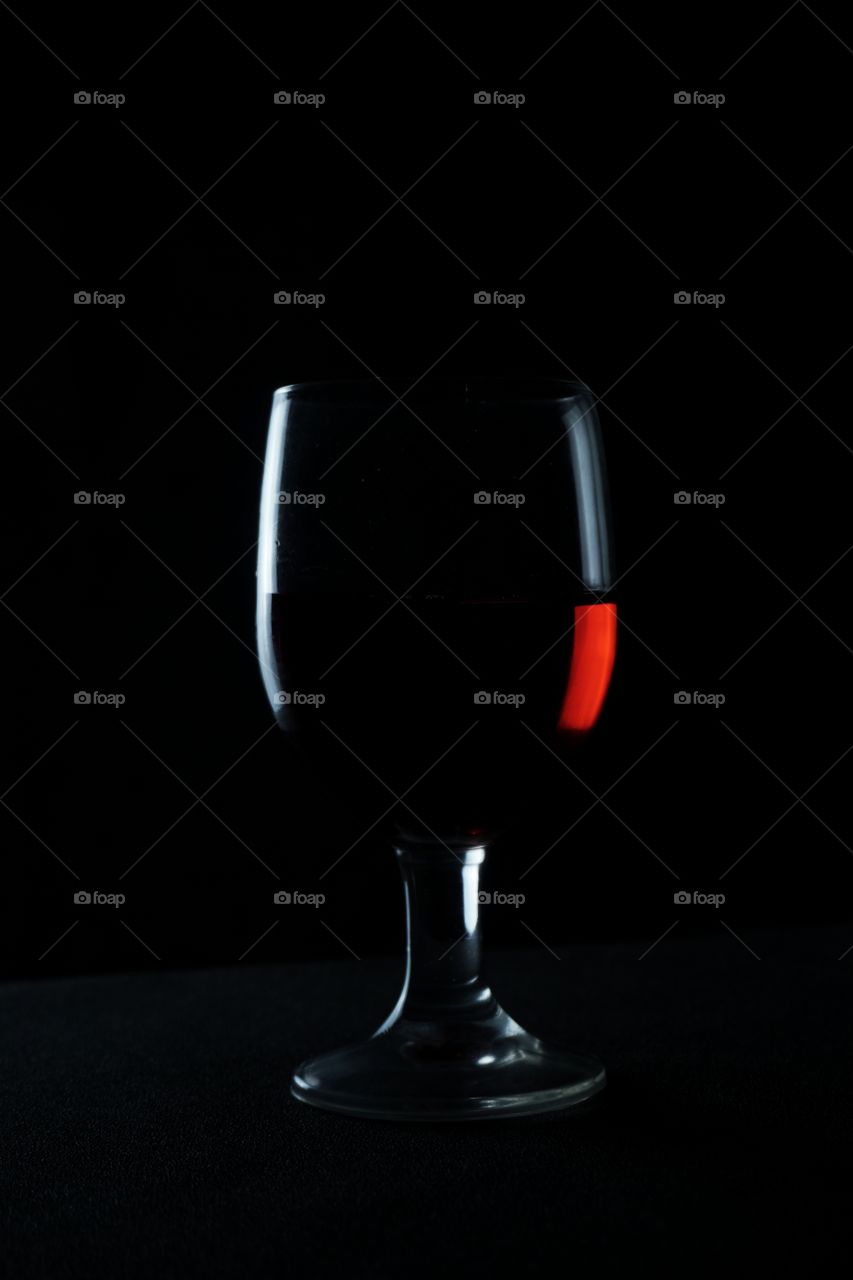 silhouette of red wine glass