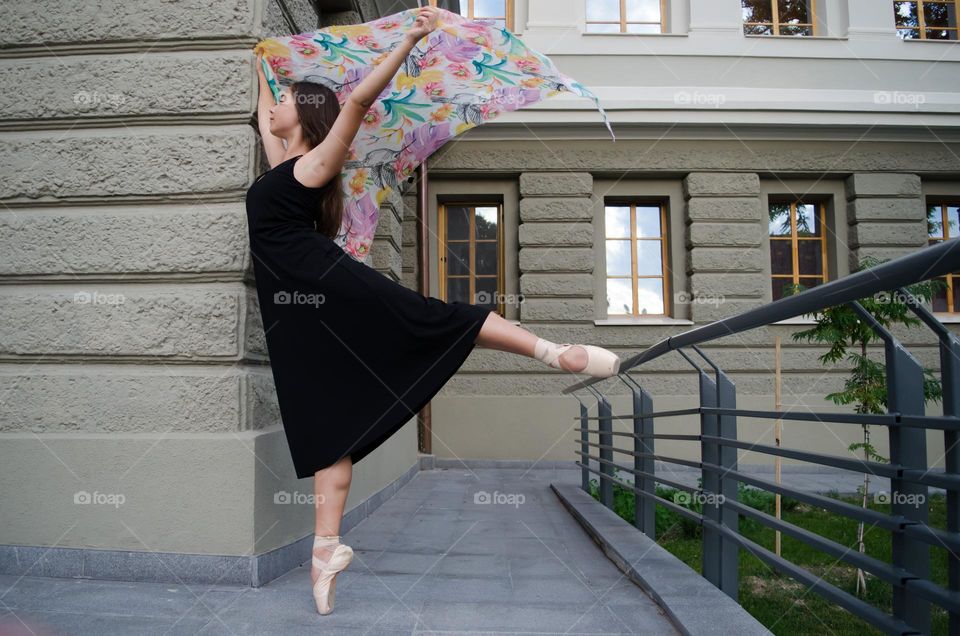 Young Female Ballerina Dancing Outside with Scarf