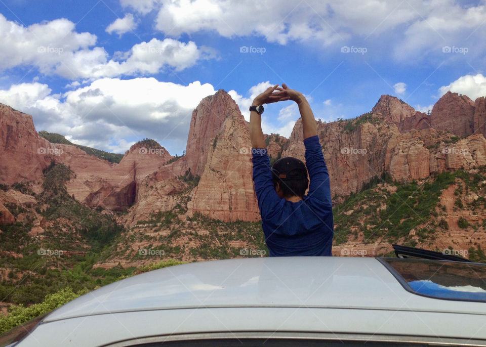 Stretching taking a break from driving while enjoying the scenery 