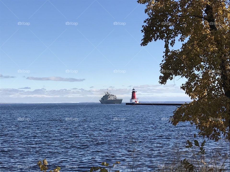 Lighthouse with ship