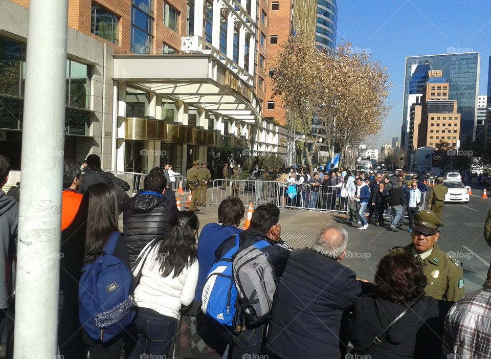 soccer fans wait for the Argentinian team outside a Chilean hotel