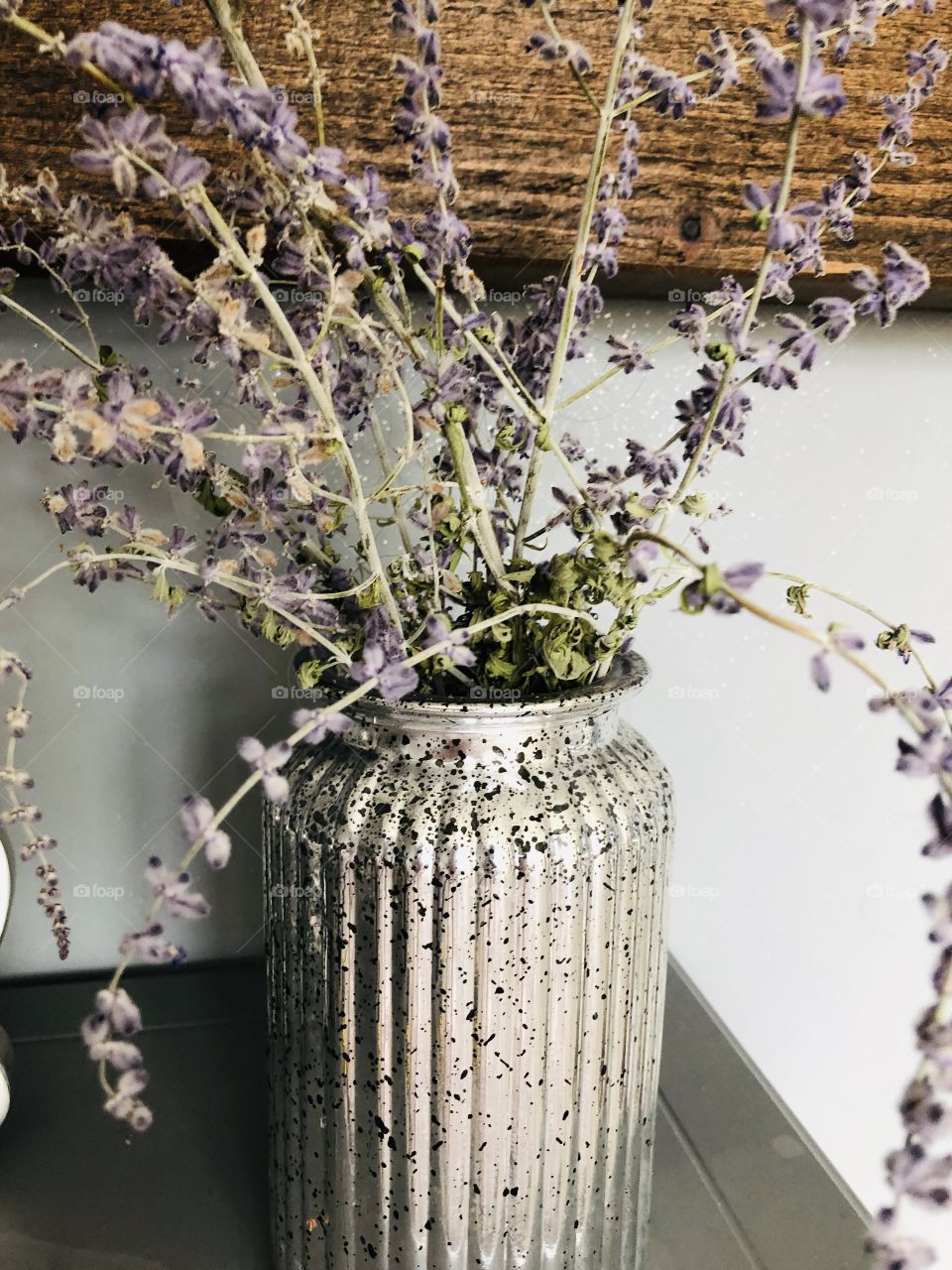 Garden flowers in a silver vase 