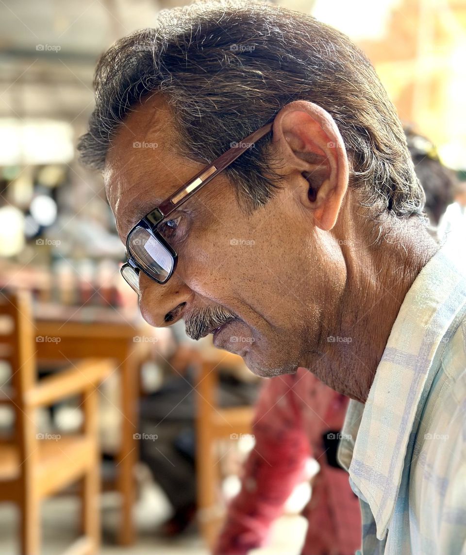 Side pose of an old man