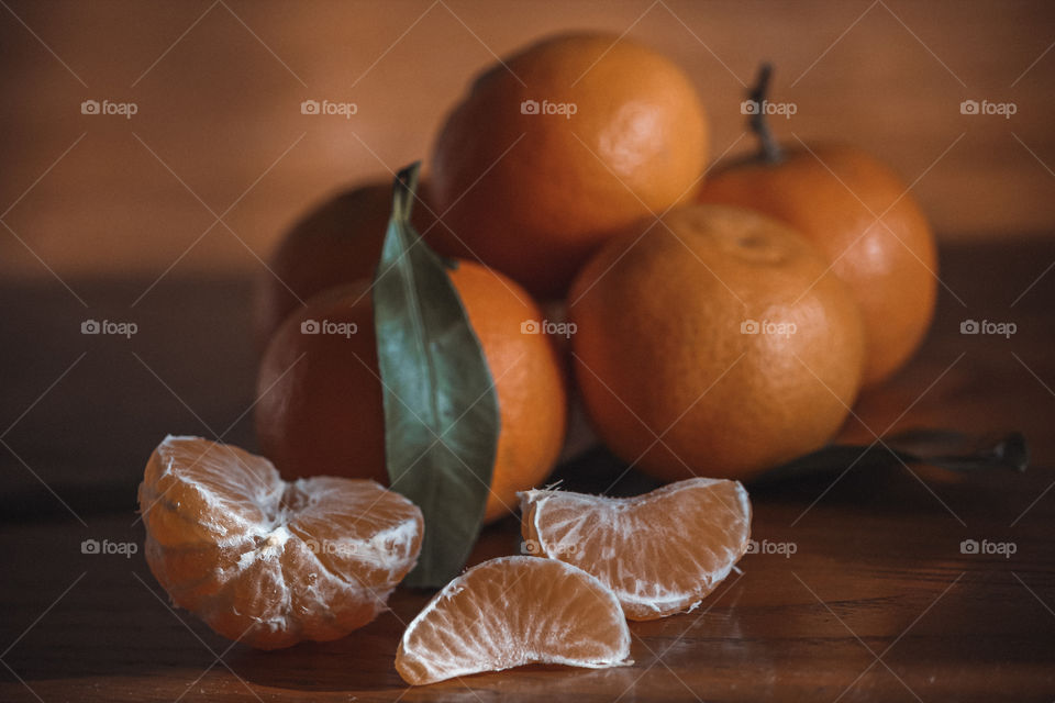 Orange fruits on wooden table