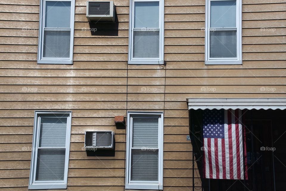 AMERICAN Flag on the facade of a house