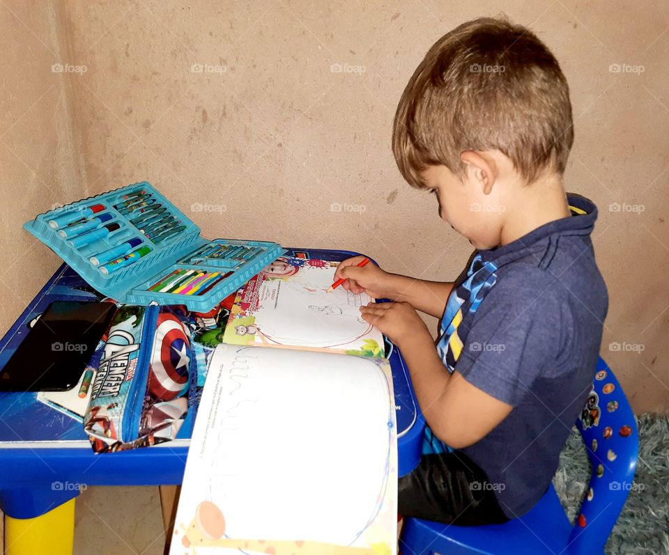 child studying doing homework