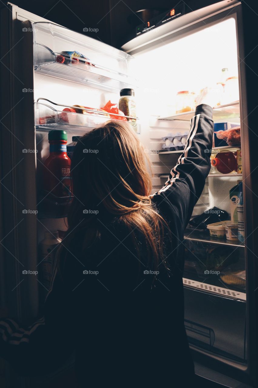 Girl at the refrigerator