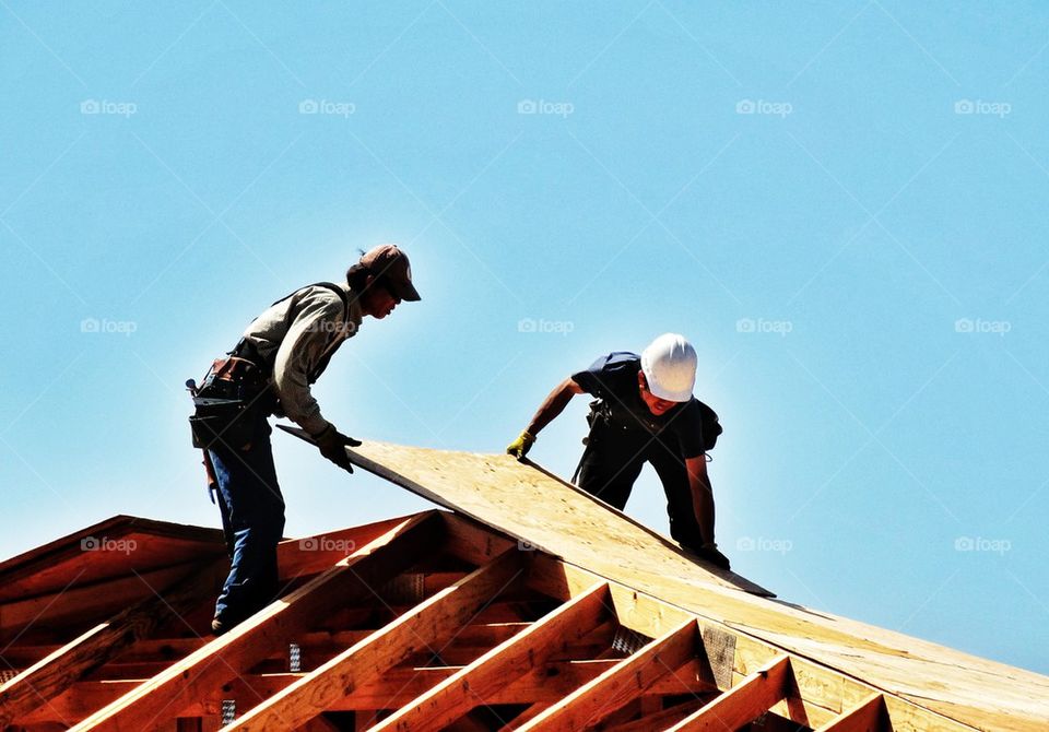 Construction workers building a home